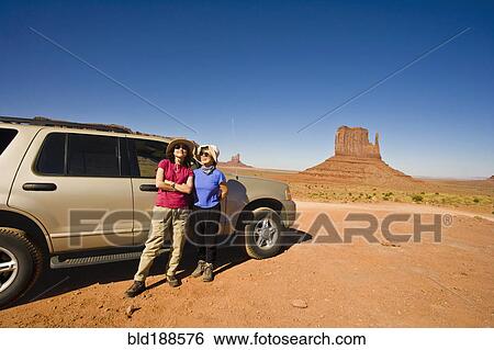 Stock Photograph - Asian mother and daughter in desert. Fotosearch