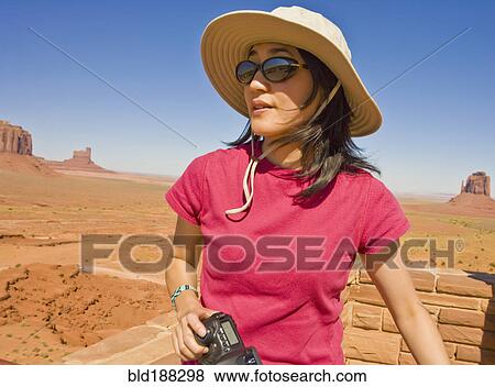 Stock Photo - Asian woman in desert. Fotosearch