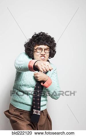 Asian woman punching air View Large Photo Image Stock Image - Asian woman punching air. Fotosearch