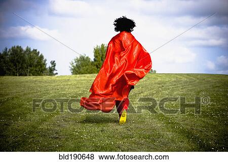 Stock Photo - Asian woman running in field. Fotosearch