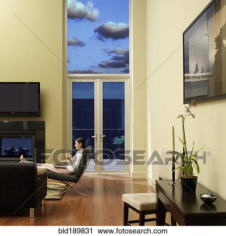 Stock Image - Asian woman typing on laptop. Fotosearch