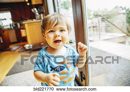 Baby boy walking in kitchen View Large Photo Image Stock Image - Baby boy walking in kitchen. Fotosearch