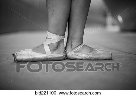 Stock Image - Ballet dancers wearing pointe shoes. Fotosearch