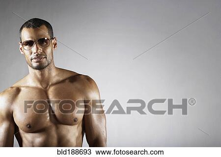 Bare chested mixed race man in sunglasses View Large Photo Image Stock Image - Bare chested mixed race man in sunglasses. Fotosearch