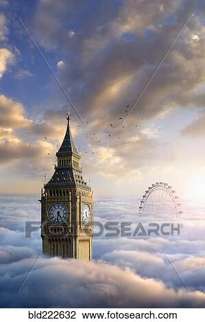 Stock Image - Birds flying around clock tower near ferris wheel above clouds. Fotosearch