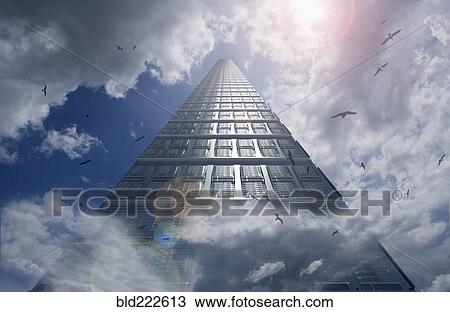 Stock Image - Birds flying around computer server in clouds. Fotosearch