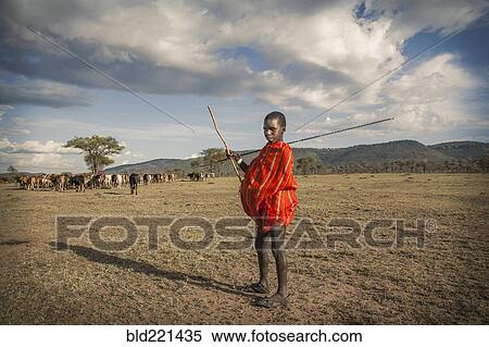 Black boy in traditional clothing standing in remote field View Large Photo Image Stock Photography - Black boy in traditional clothing standing in remote field. Fotosearch