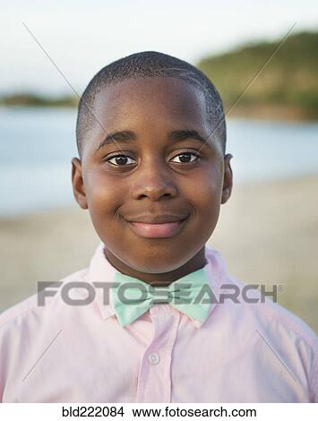 Black boy wearing bow tie outdoors View Large Photo Image Picture - Black boy wearing bow tie outdoors. Fotosearch