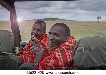 Black men smiling in car in remote field View Large Photo Image Stock Photo - Black men smiling in car in remote field. Fotosearch