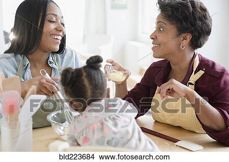 Black multi-generation family baking View Large Photo Image Picture - Black multi-generation family baking. Fotosearch
