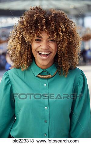 Stock Photo - Black woman laughing outdoors. Fotosearch