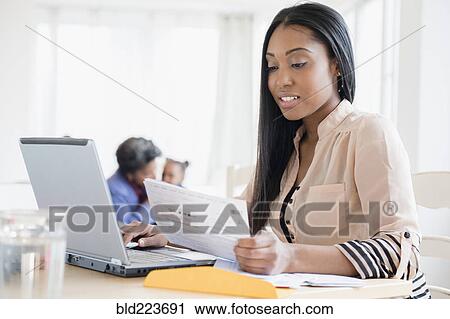 Black woman paying bills using laptop View Large Photo Image Stock Image - Black woman paying bills using laptop. Fotosearch