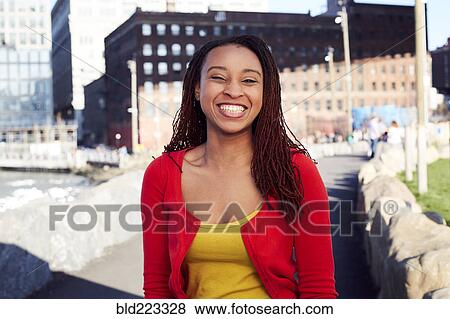 Black woman smiling at waterfront View Large Photo Image Stock Photo - Black woman smiling at waterfront. Fotosearch