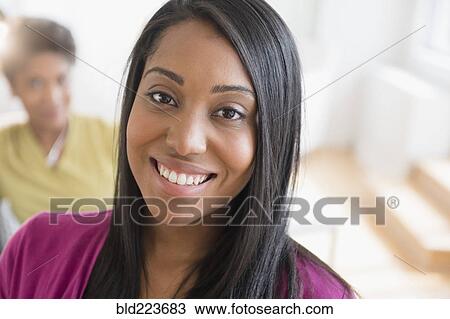 Stock Image - Black woman smiling. Fotosearch