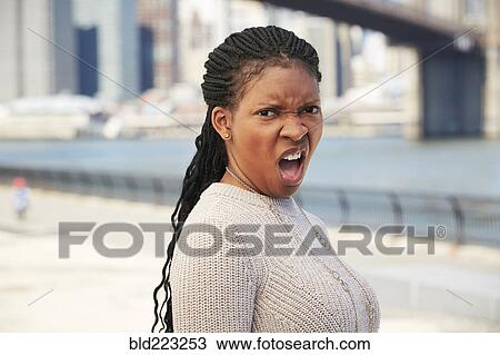 Black woman with disgusted attitude at waterfront View Large Photo Image Stock Image - Black woman with disgusted attitude at waterfront. Fotosearch