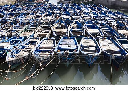 Blue boats secured with rope View Large Photo Image Stock Image - Blue boats secured with rope. Fotosearch