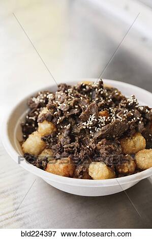 Bowl of steak and tater tots View Large Photo Image Stock Photo - Bowl of steak and tater tots. Fotosearch