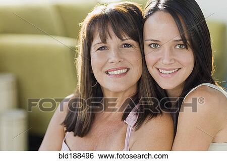 Brazilian mother and daughter hugging View Large Photo Image Stock Photograph - Brazilian mother and daughter hugging. Fotosearch