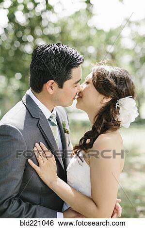 Bride and groom kissing View Large Photo Image Stock Photograph - Bride and groom kissing. Fotosearch