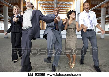 Stock Photography - Business people dancing in empty office space. Fotosearch