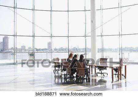 Stock Image - Business people in conference room for meeting. Fotosearch