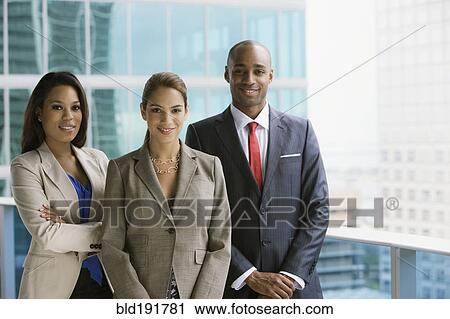 Stock Image - Business people on urban balcony. Fotosearch