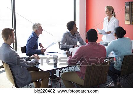 Stock Image - Business people talking in conference room meeting. Fotosearch