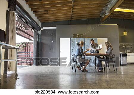 Business people talking in office meeting View Large Photo Image Picture - Business people talking in office meeting. Fotosearch