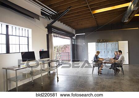 Business people talking in office meeting View Large Photo Image Stock Image - Business people talking in office meeting. Fotosearch