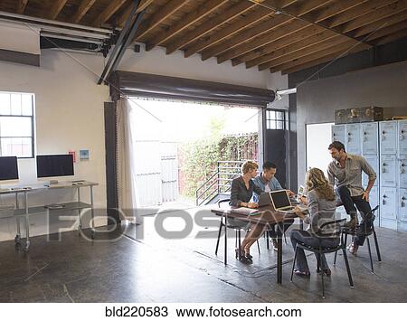 Business people talking in office meeting View Large Photo Image Stock Image - Business people talking in office meeting. Fotosearch