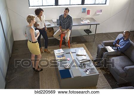 Stock Photo - Business people talking in office. Fotosearch