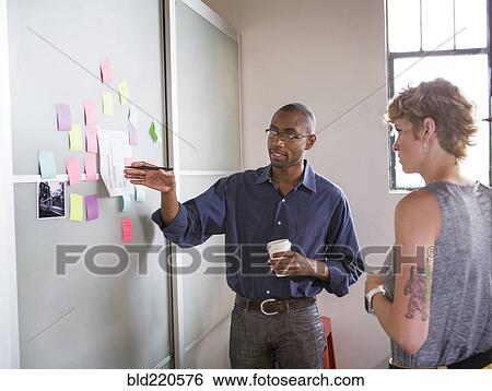Stock Photograph - Business people talking in office. Fotosearch