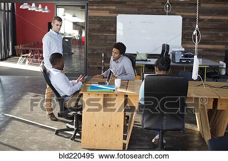 Business people talking in office View Large Photo Image Stock Photography - Business people talking in office. Fotosearch