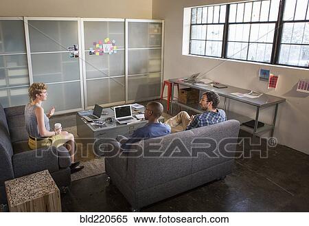 Stock Photography - Business people talking in office. Fotosearch