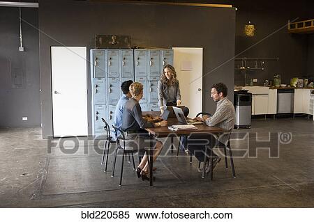 Business people talking in office meeting View Large Photo Image Stock Photography - Business people talking in office meeting. Fotosearch