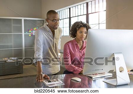 Business people using computer in office View Large Photo Image Stock Photography - Business people using computer in office. Fotosearch