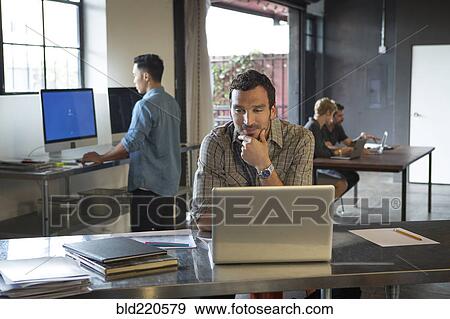 Business people working in office View Large Photo Image Stock Photo - Business people working in office. Fotosearch