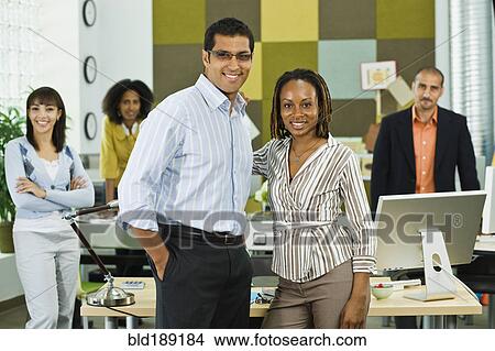 Picture - Business people working together in office. Fotosearch