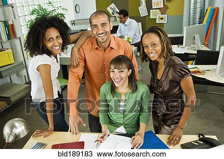 Business people working together in office View Large Photo Image Stock Image - Business people working together in office. Fotosearch