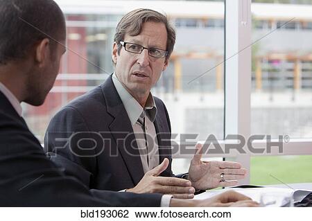 Businessmen talking View Large Photo Image Stock Image - Businessmen talking. Fotosearch