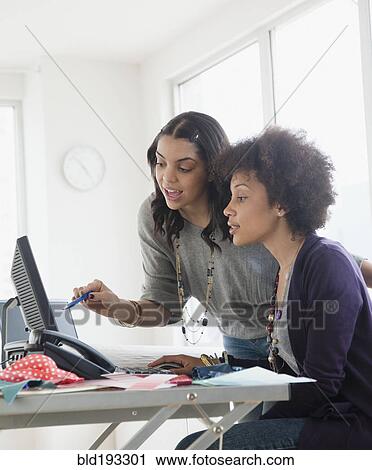 Businesswoman working in office together View Large Photo Image Stock Image - Businesswoman working in office together. Fotosearch