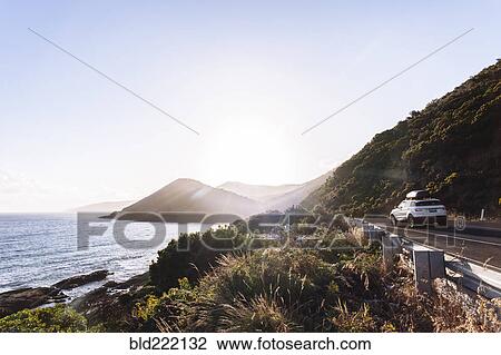 Car driving on coastal road View Large Photo Image Stock Image - Car driving on coastal road. Fotosearch