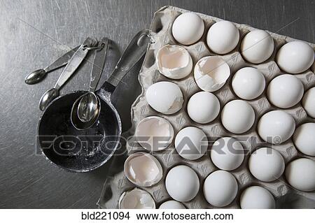 Carton of eggs with measuring spoons View Large Photo Image Picture - Carton of eggs with measuring spoons. Fotosearch