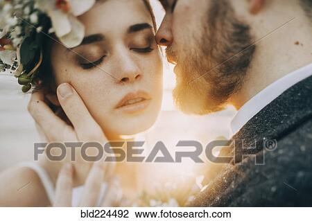 Caucasian bride and groom on sunny day View Large Photo Image Stock Image - Caucasian bride and groom on sunny day. Fotosearch
