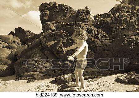 Caucasian brother and sister playing on beach View Large Photo Image Stock Photo - Caucasian brother and sister playing on beach. Fotosearch