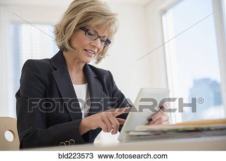 Caucasian businesswoman using digital tablet View Large Photo Image Stock Image - Caucasian businesswoman using digital tablet. Fotosearch