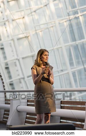 Caucasian businesswomen using cell phone View Large Photo Image Stock Image - Caucasian businesswomen using cell phone. Fotosearch
