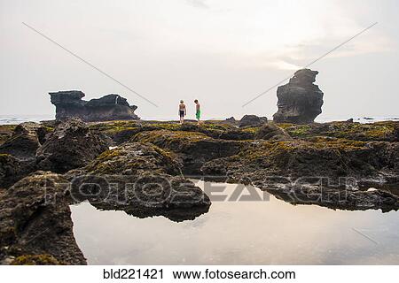 Caucasian children exploring rocky tidal pools, Canggu, Bali, Indonesia View Large Photo Image Stock Image - Caucasian children exploring rocky tidal pools, Canggu, Bali, Indonesia. Fotosearch