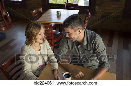 Caucasian couple drinking coffee in cafe View Large Photo Image Stock Image - Caucasian couple drinking coffee in cafe. Fotosearch