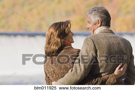 Caucasian couple hugging outdoors View Large Photo Image Stock Photography - Caucasian couple hugging outdoors. Fotosearch